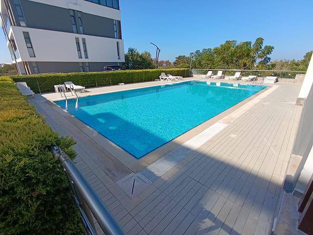 Girne Lapta Da Havuzlu Güvenlikli Site İçerisinde Merkezi Isıtma Sistemli 1+1 Aylık Ödemeli Full Eşyalı Kiralık Daire