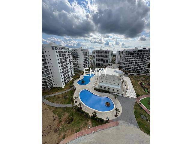 Sözleşme Devir Ücreti Yok Kıbrıs İskele'de 2+1 Caesar Resort Sitesinde Havuz Manzaralı Yatırım Fırsatı Daire